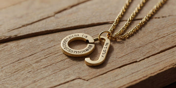 Close-up of custom necklaces on a display stand