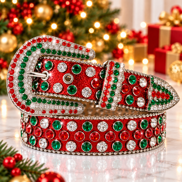 Rhinestone western belt with red strap, green crystal rows, silver-tone buckle and pointed end.