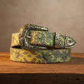 Rhinestone art-style belt with silver buckle and colorful scalloped pattern on green strap