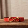 Red leather belt with gold infinity name buckle, cursive lettering on centerpiece